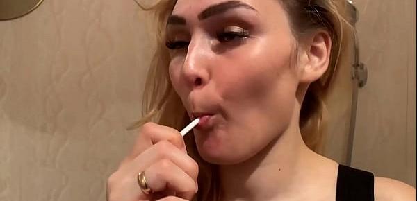  Charming Lady in Sexy Lingerie Licking Lollipop